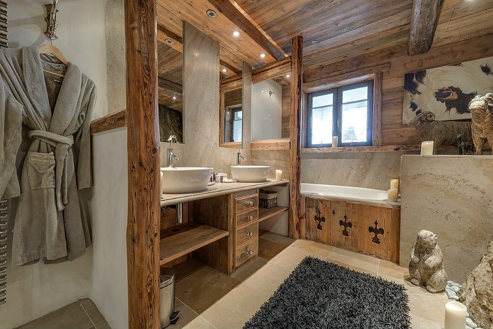 Cozy bathroom of the luxury chalet with a bathtub that keeps you warm and fresh