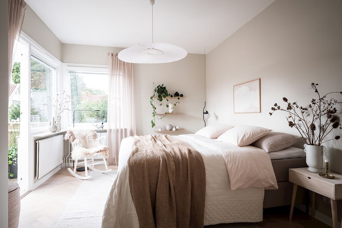 Cozy textures, indoor plants and neutrals help create the perfect modern bedroom