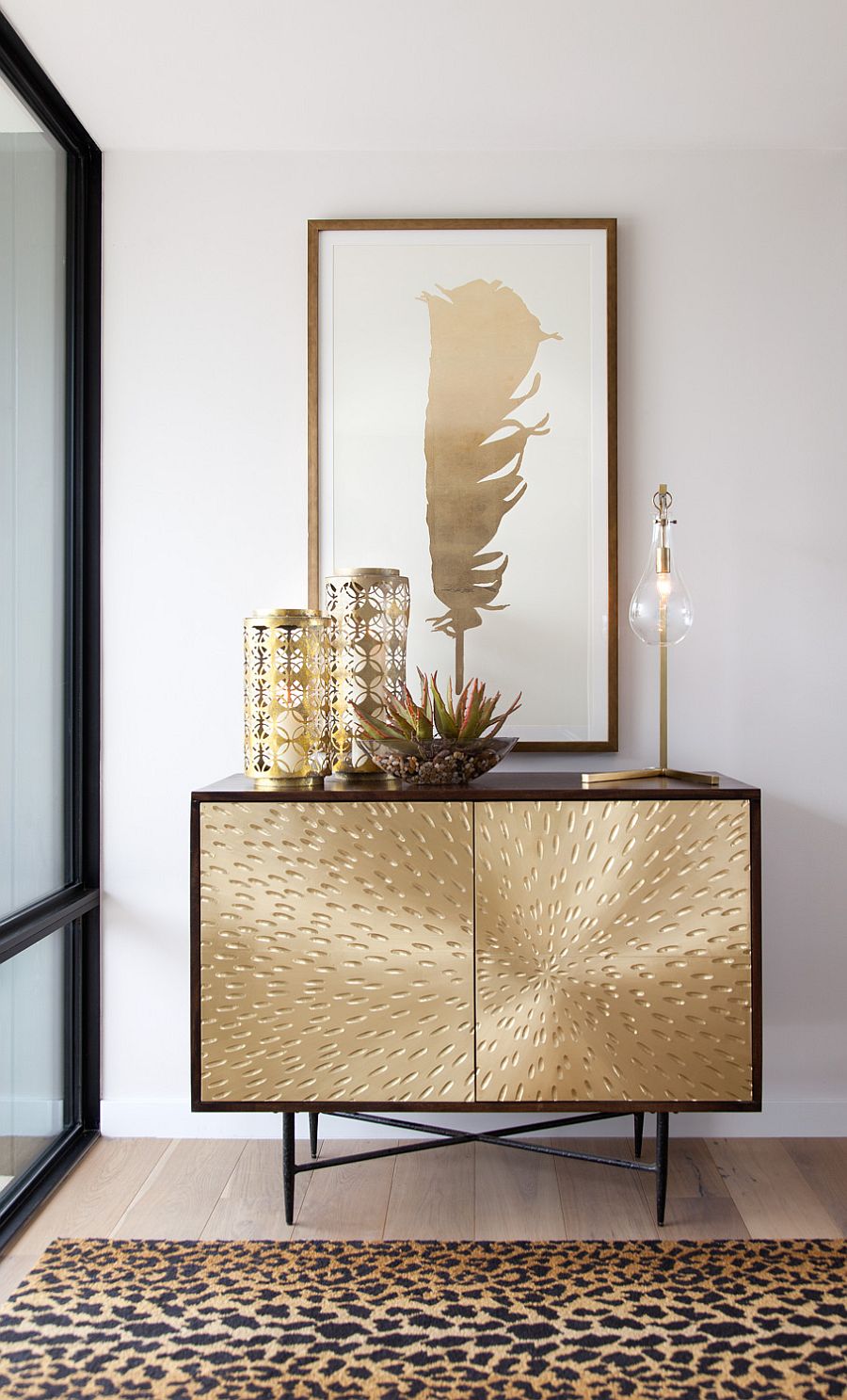 Entry foyer with a fabulous golden console table and lovely decorative pieces