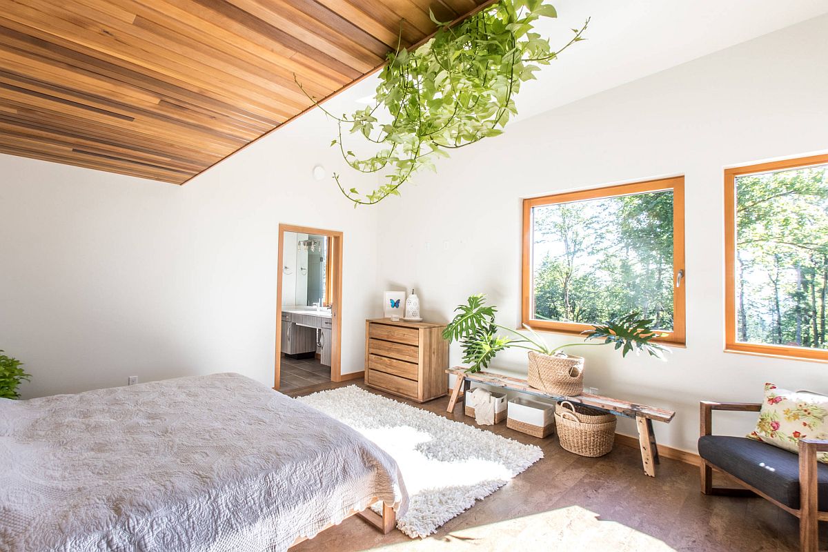 Finding innovative ways to add greenery to the small modern bedroom with lovely views of canopy outside