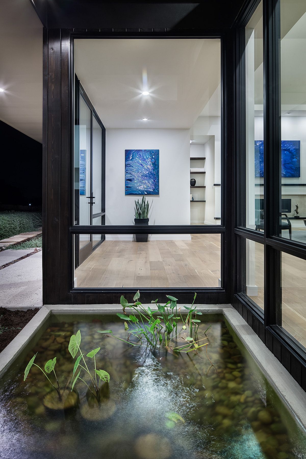 Glass windows bring the gorgeous courtyard water feature indoors!