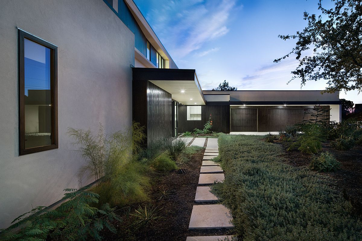 Landscape outside the house is all about fabulous lighting and ample greenery