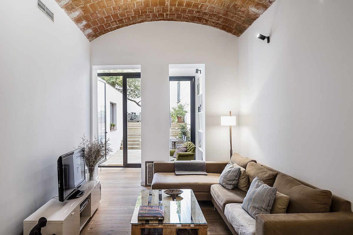 Light-filled-and-bright-living-area-of-the-home-in-Barcelona-that-was-previously-a-confectionary-shop-68220