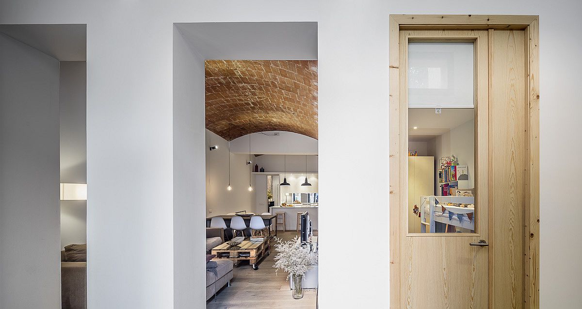 Revamped interior of the old ground level shop in Barcelona turned into a lovely modern home