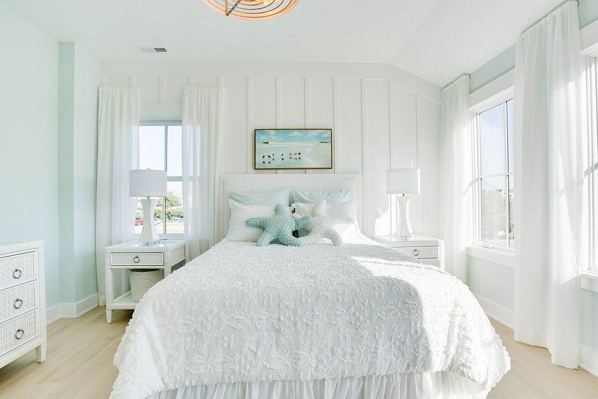 Very light pastel hues coupled with white to create a relaxing and chic bedroom