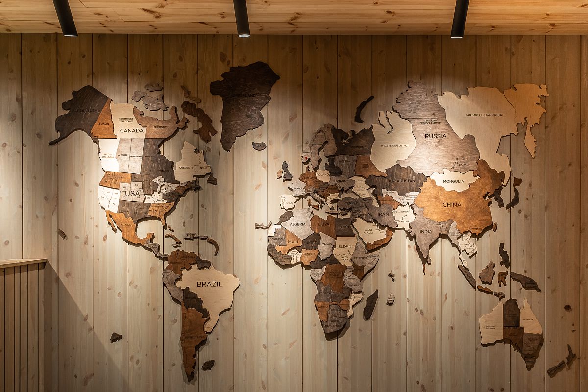 World map in wood becomes a lovely focal point inside the hotel corridor