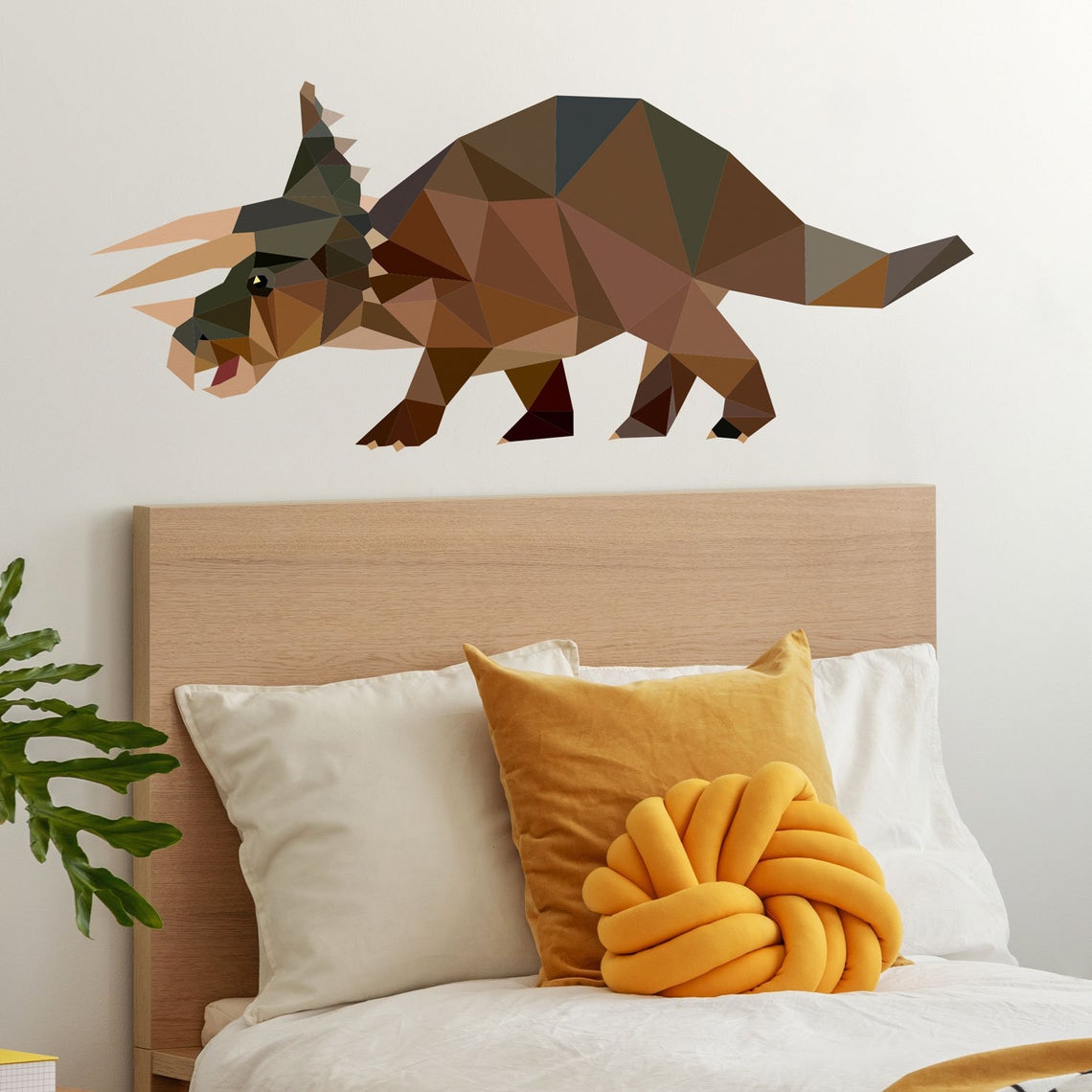 Bed with rhino on the wall