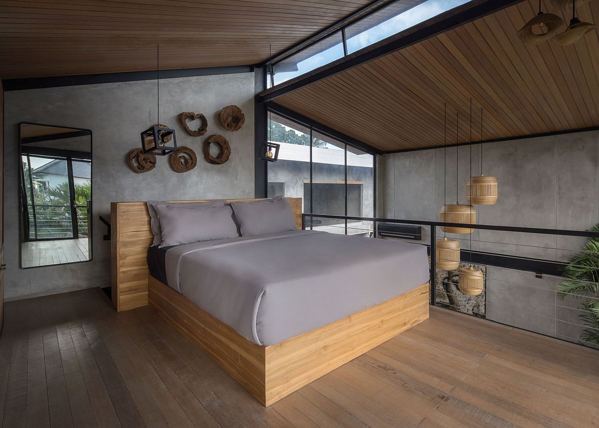 Bedroom on the upper loft level with a modern-industrial style