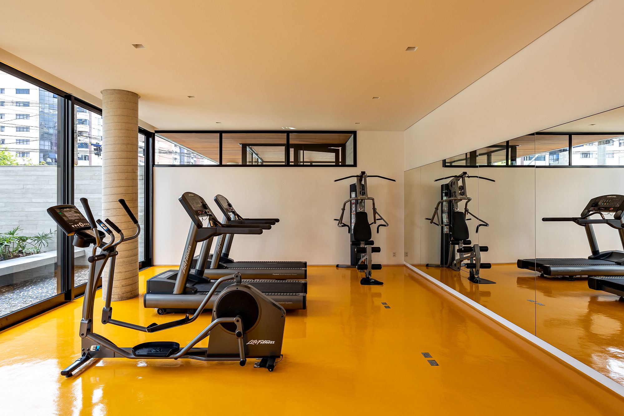 Bright and beautiful yellow floor of the gym area grabs your attention