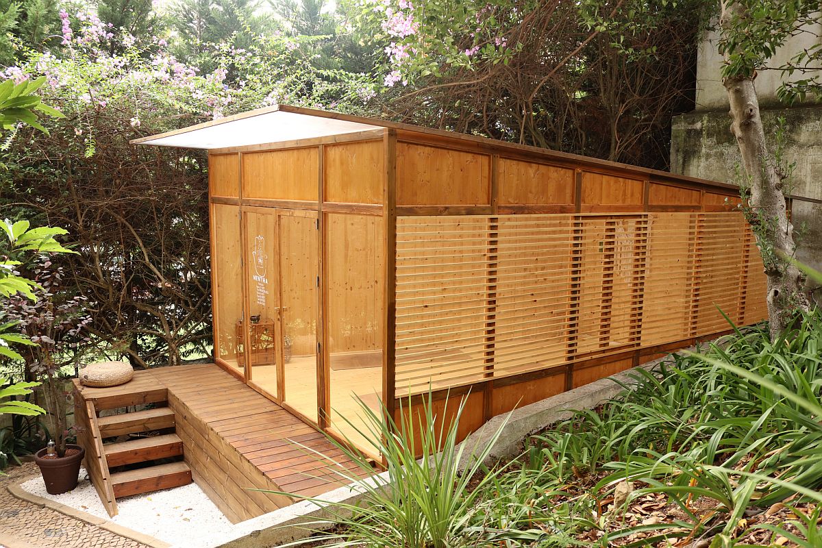 Cross-laminated timber panels shape the exterior of the small yoga studio in the backyard