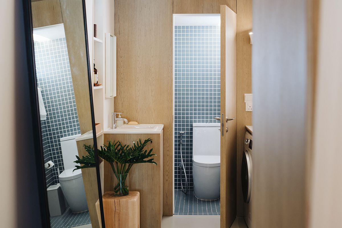 Custom tiles add pattern to the bathroom in wood and white