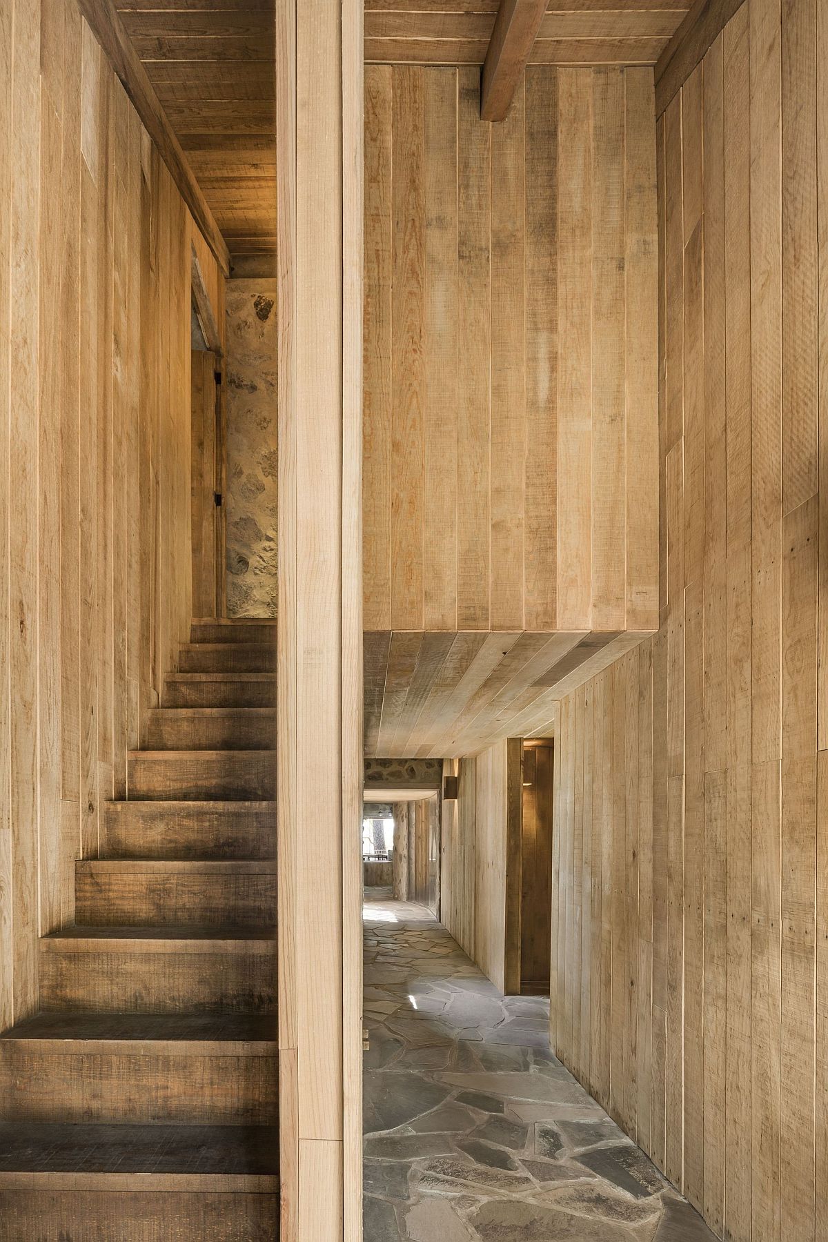 Custom wooden walls and staircase inside the cabin