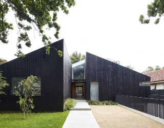 Cedar House: Dark, Dashing Exterior Conceals Cozy, Minimal Living Spaces