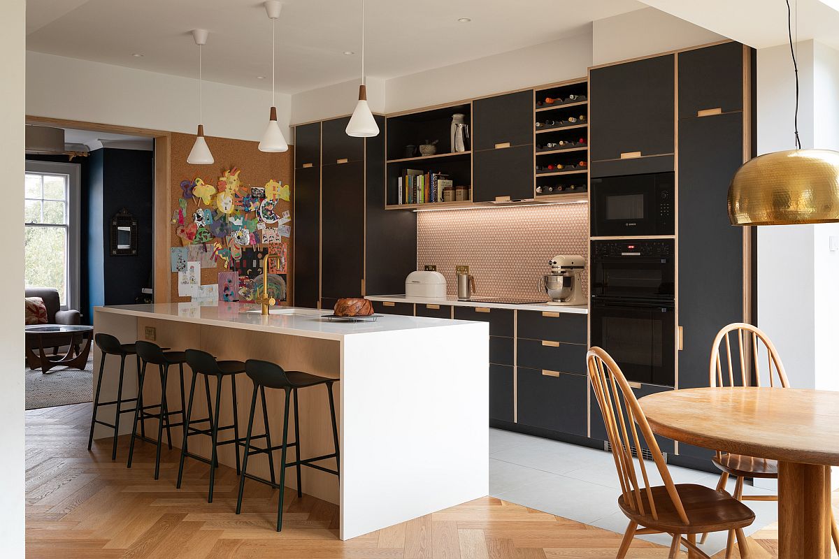 Dark wooden kitchen cabinets and shelves create and interesting backdrop