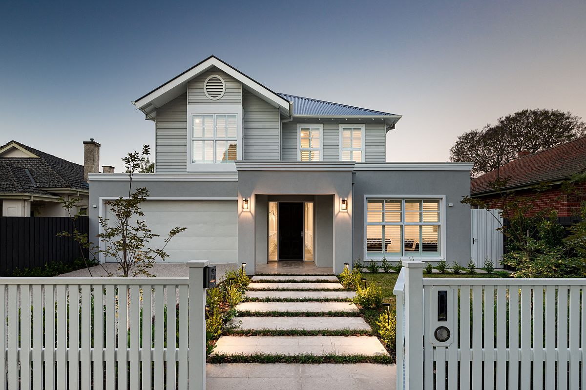 Delightful modern home facade with light gray walls and smart white trims