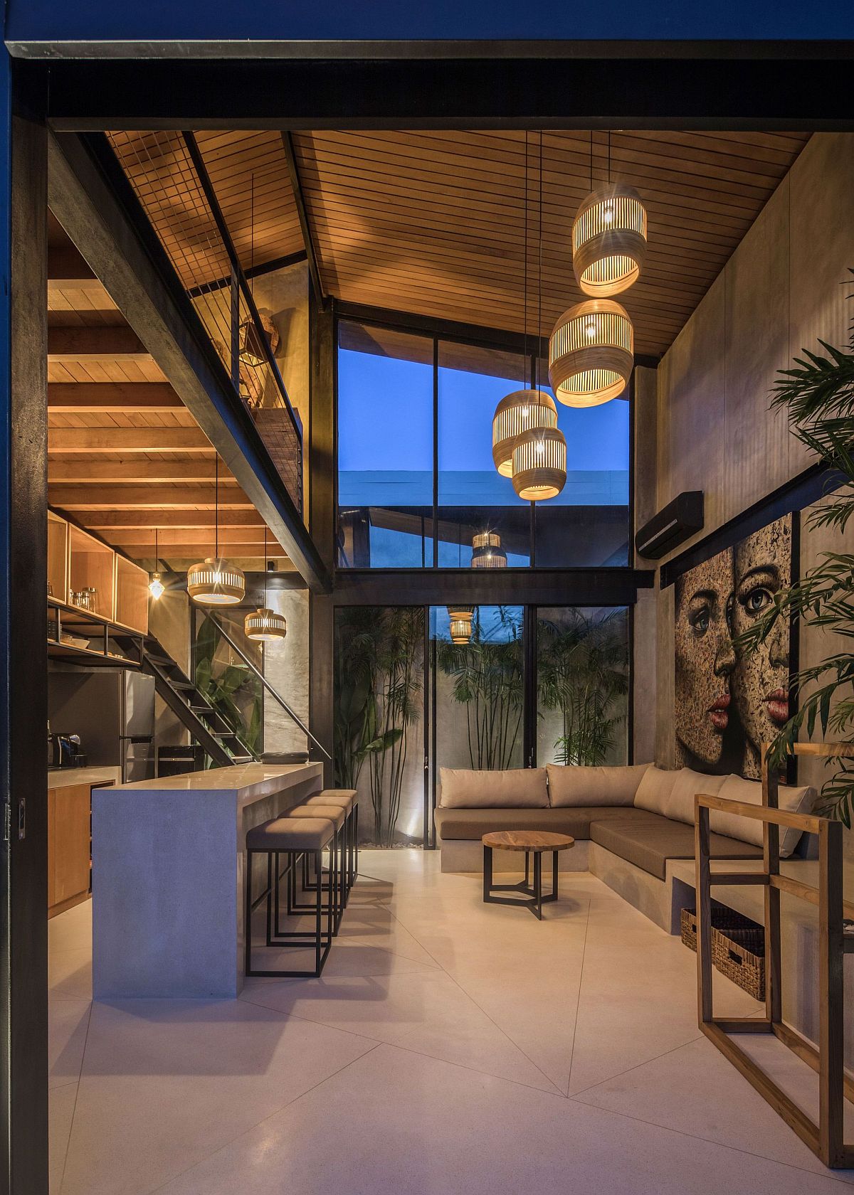 Double-height living area and kitchen of the house with fabulous lighting