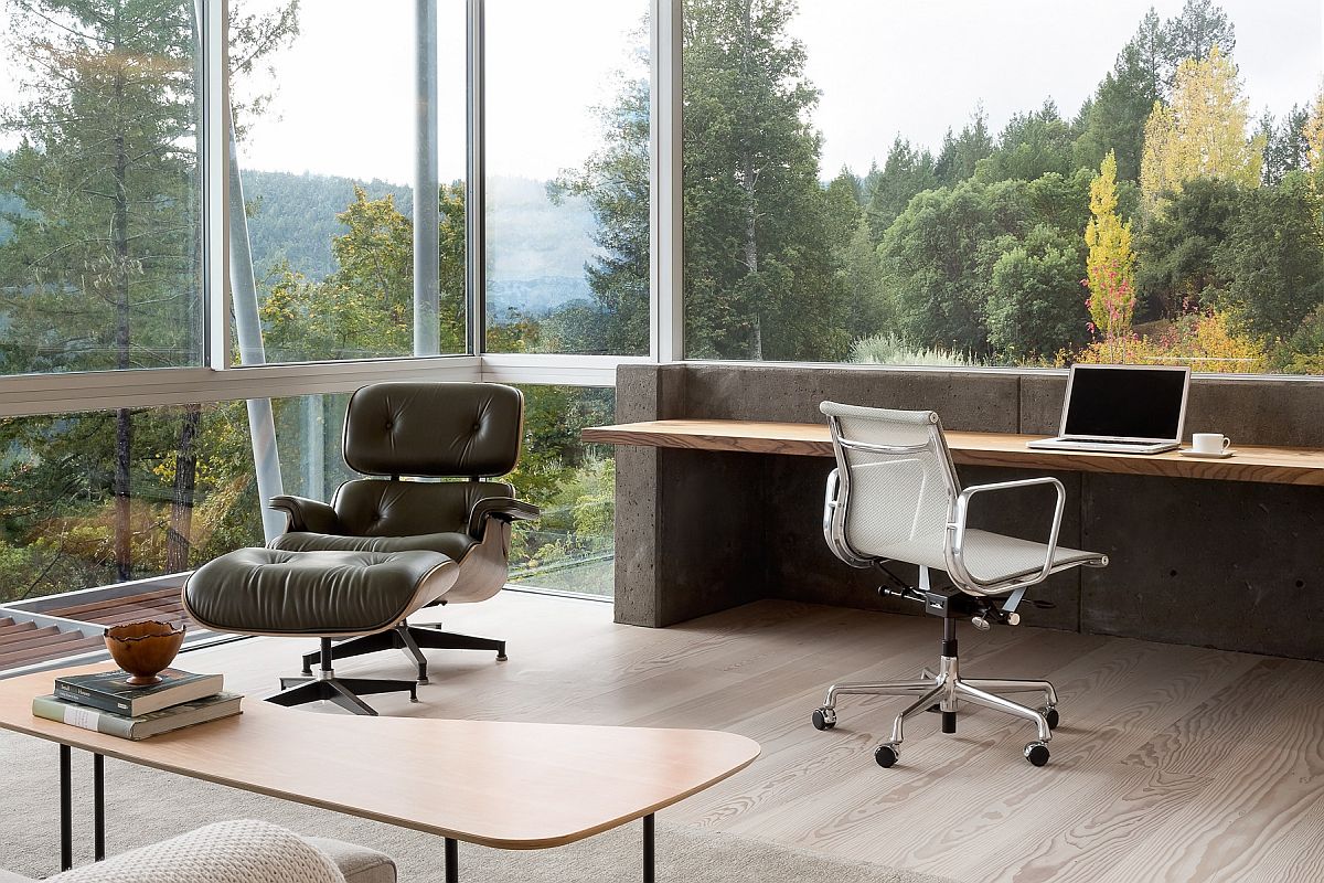 Floor-to-ceiling glass walls and large windows offer spectacular views from this home office