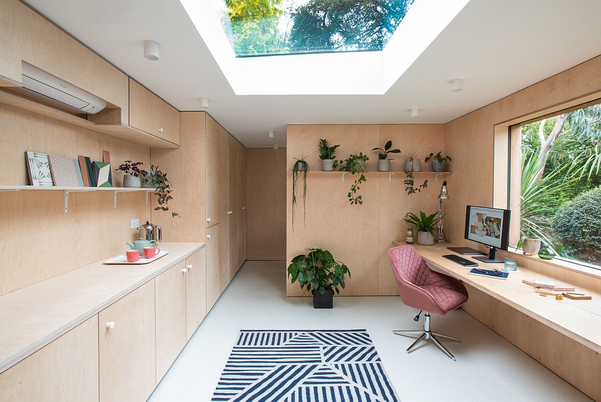 Large window and skylight usher light into this lovely home office