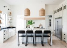 Pendants-with-a-natural-organic-finish-elevate-the-beach-style-of-this-kitchen-52310-217x155