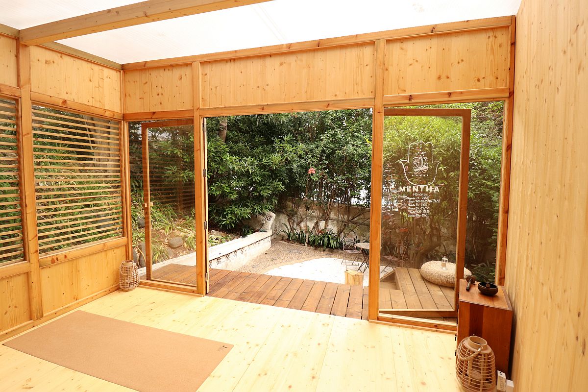 Small wooden deck outside the yoga studio extends the space beautifully