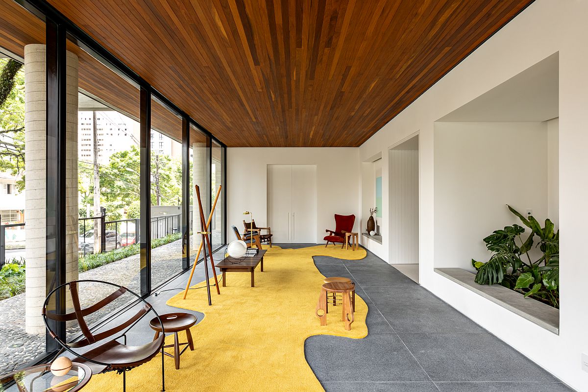 Striking and stylish hall of the common areas in Brazilian building with a bright yellow carpet