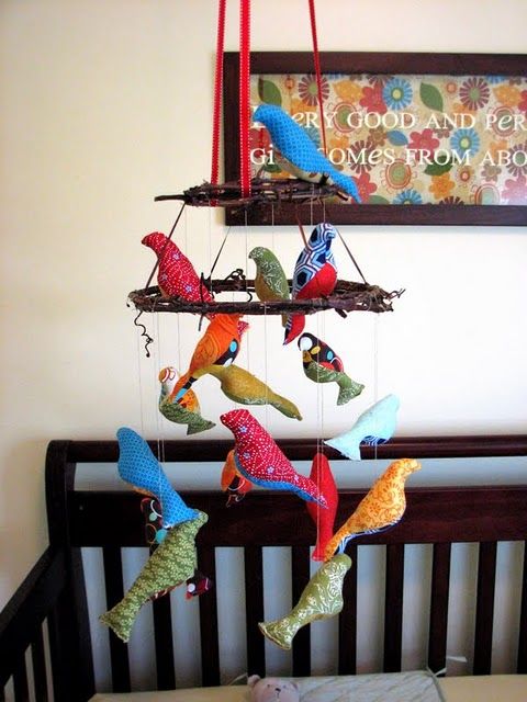 Stuffed birds hung on toy chandelier