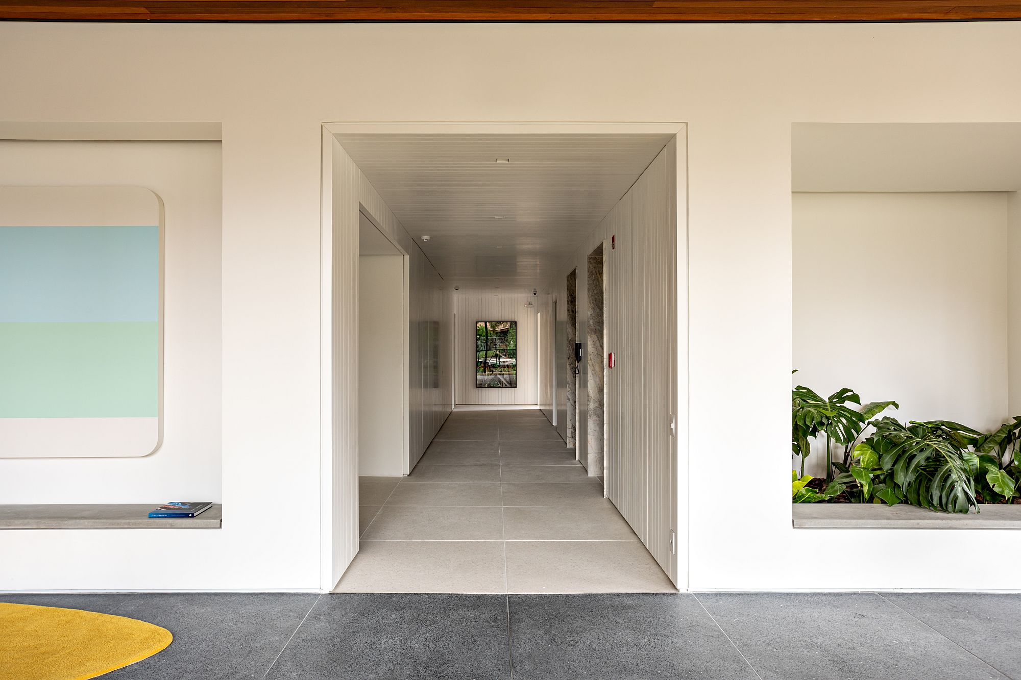 White corridor of the entry that leads to events spaces and the playareas