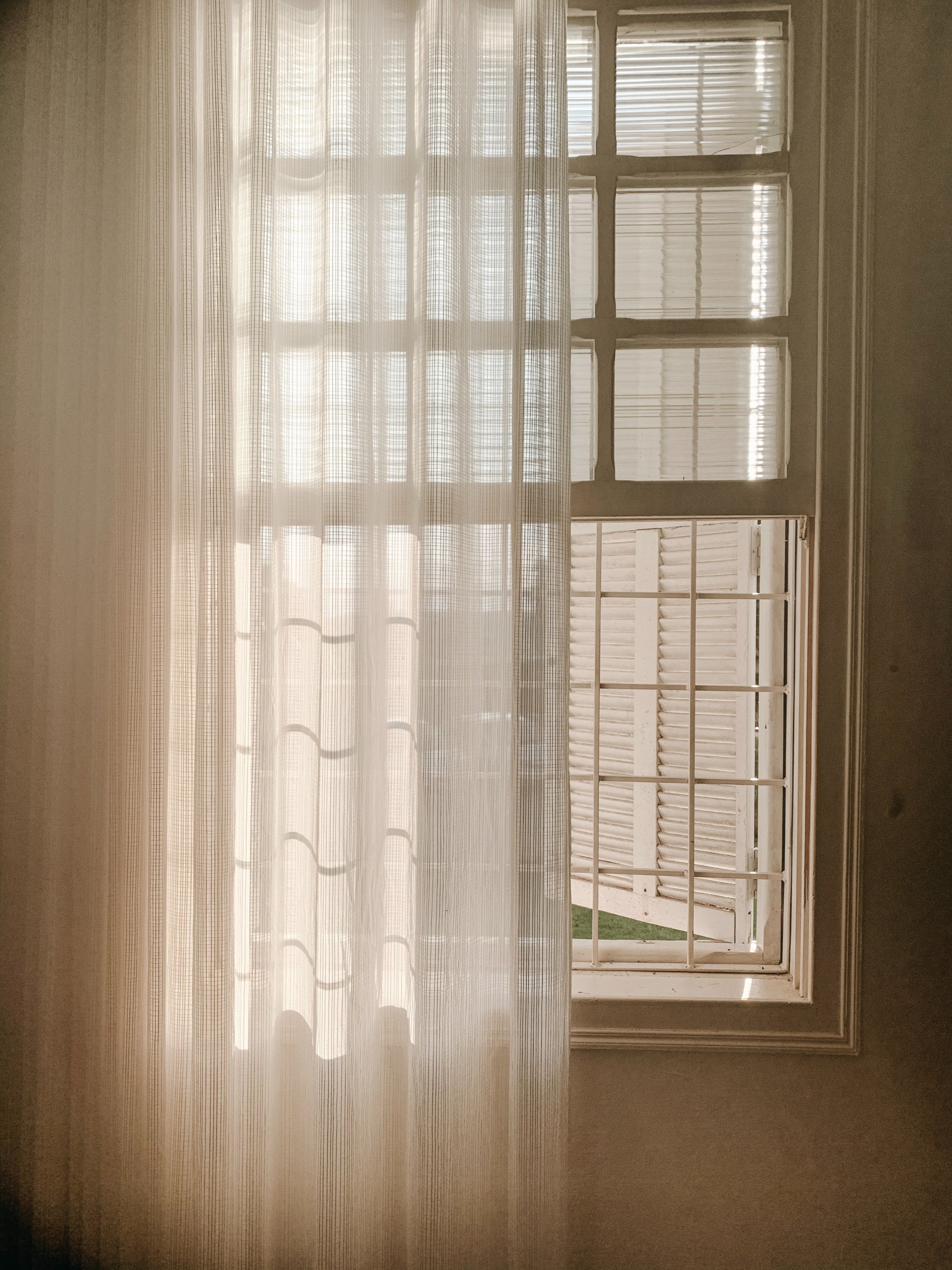 sheer curtain in front of french style window