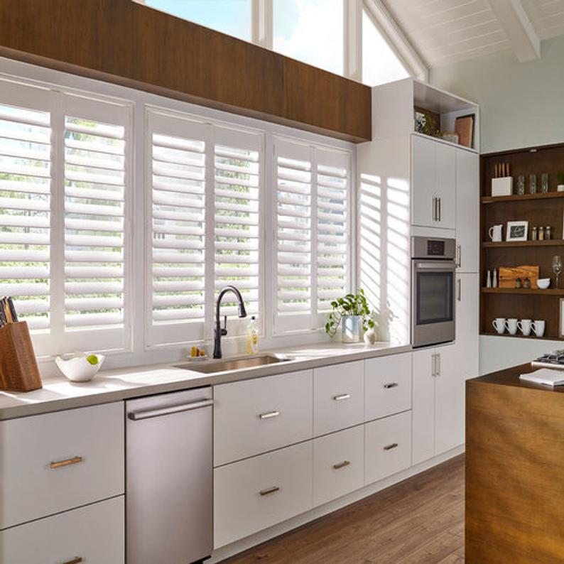 all white shutters in kitchen window