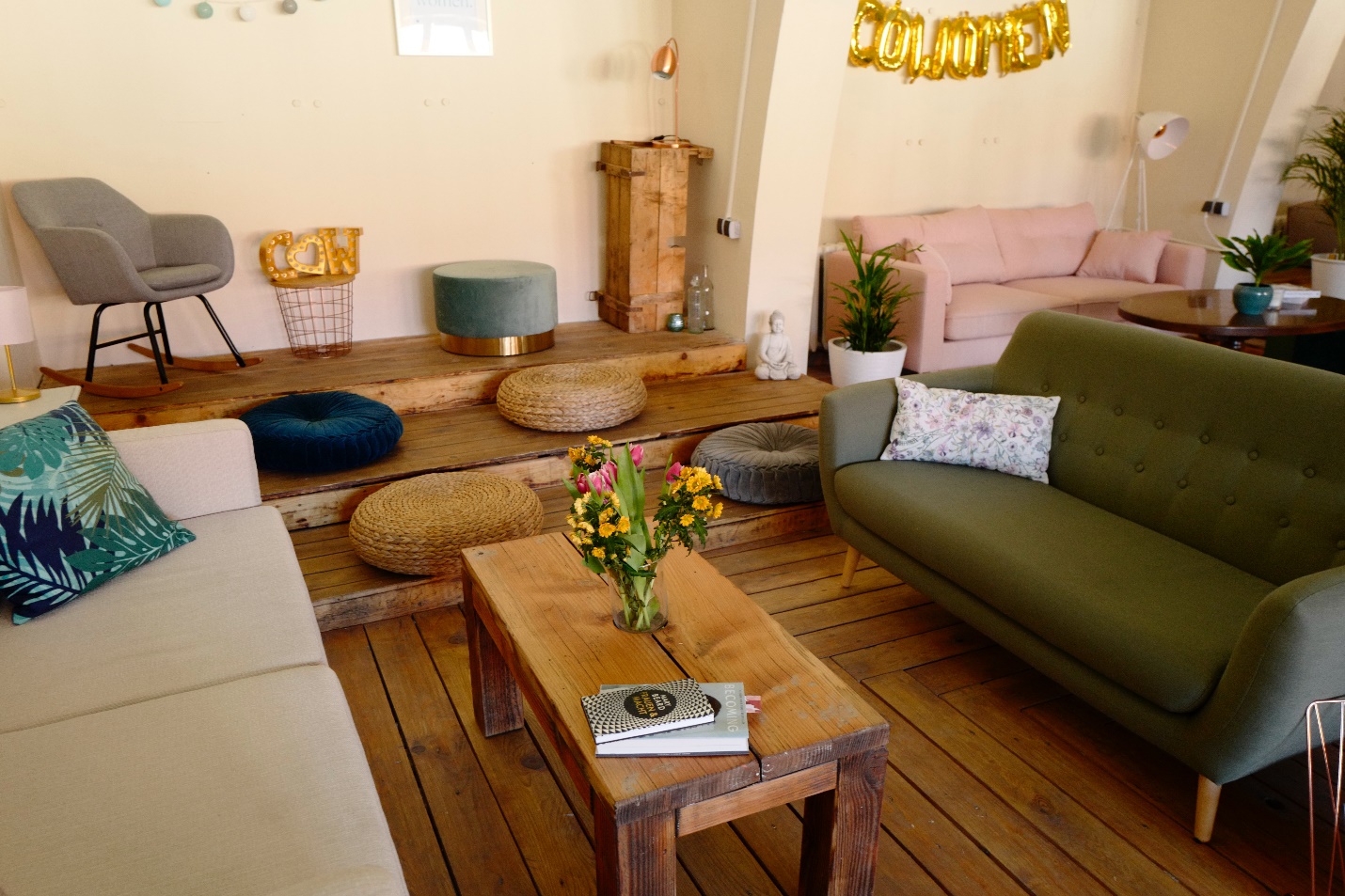 boho room with wood flooring and colorful furniture