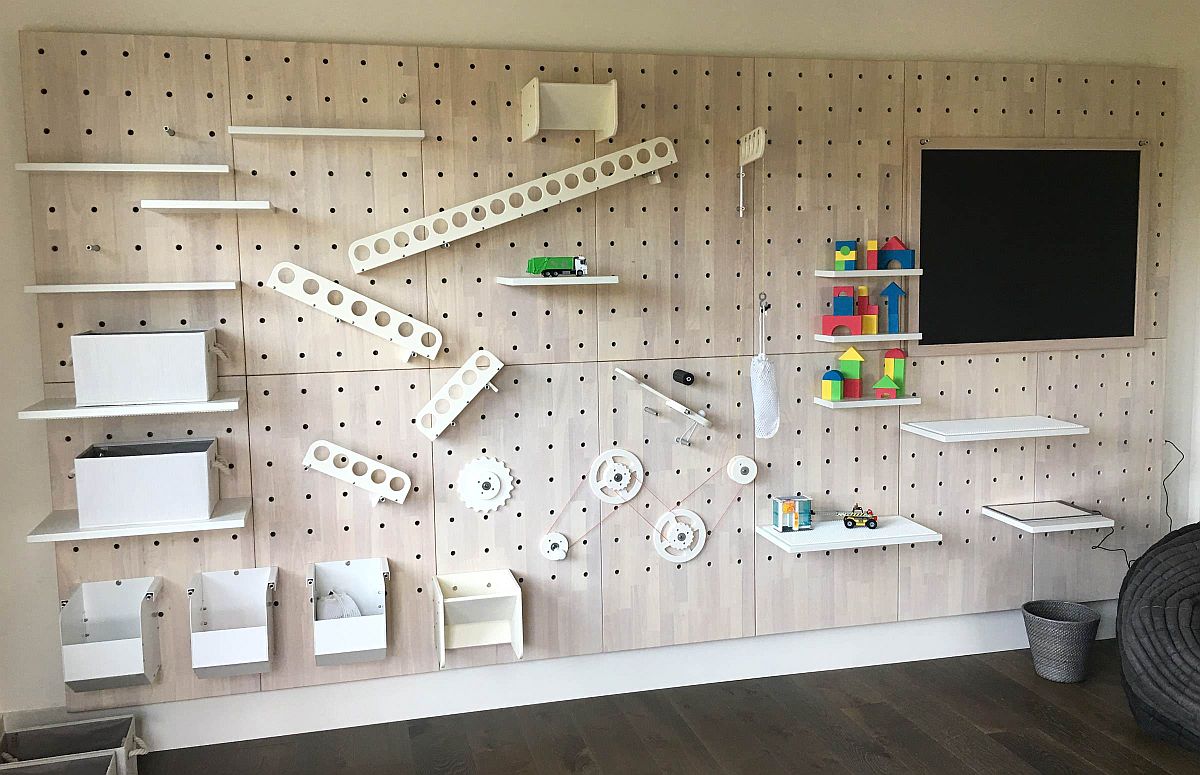 Activity wall in the kids' room combines storage and play time with creativity