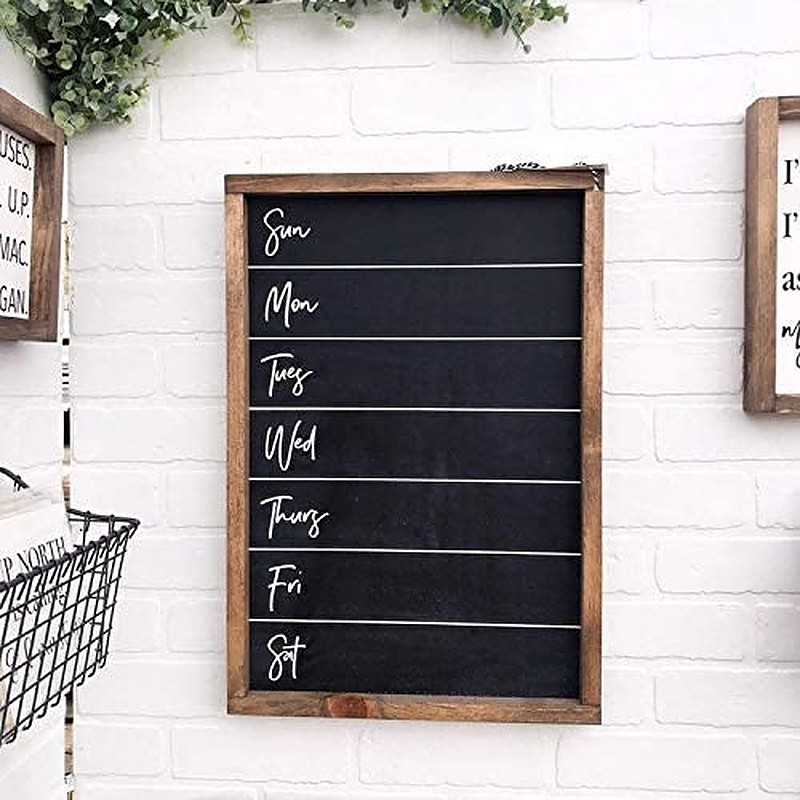 Blank weekly menu chalkboard on white brick wall