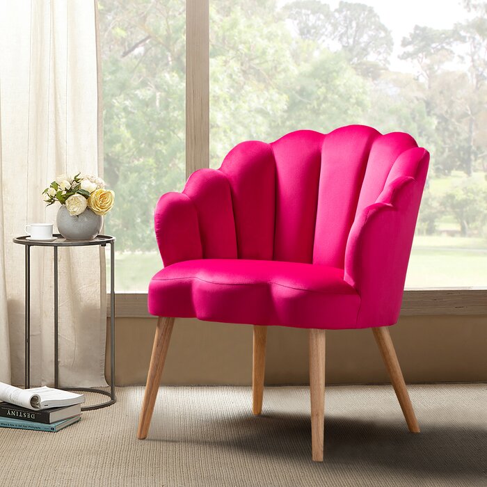 Bright pink chair in front of window
