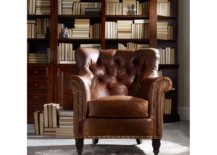Brown armchair in front of shelves of books
