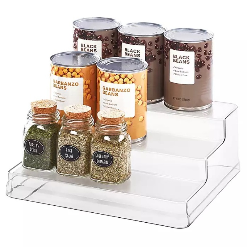 Canned beans and dry herbs on transparent rack
