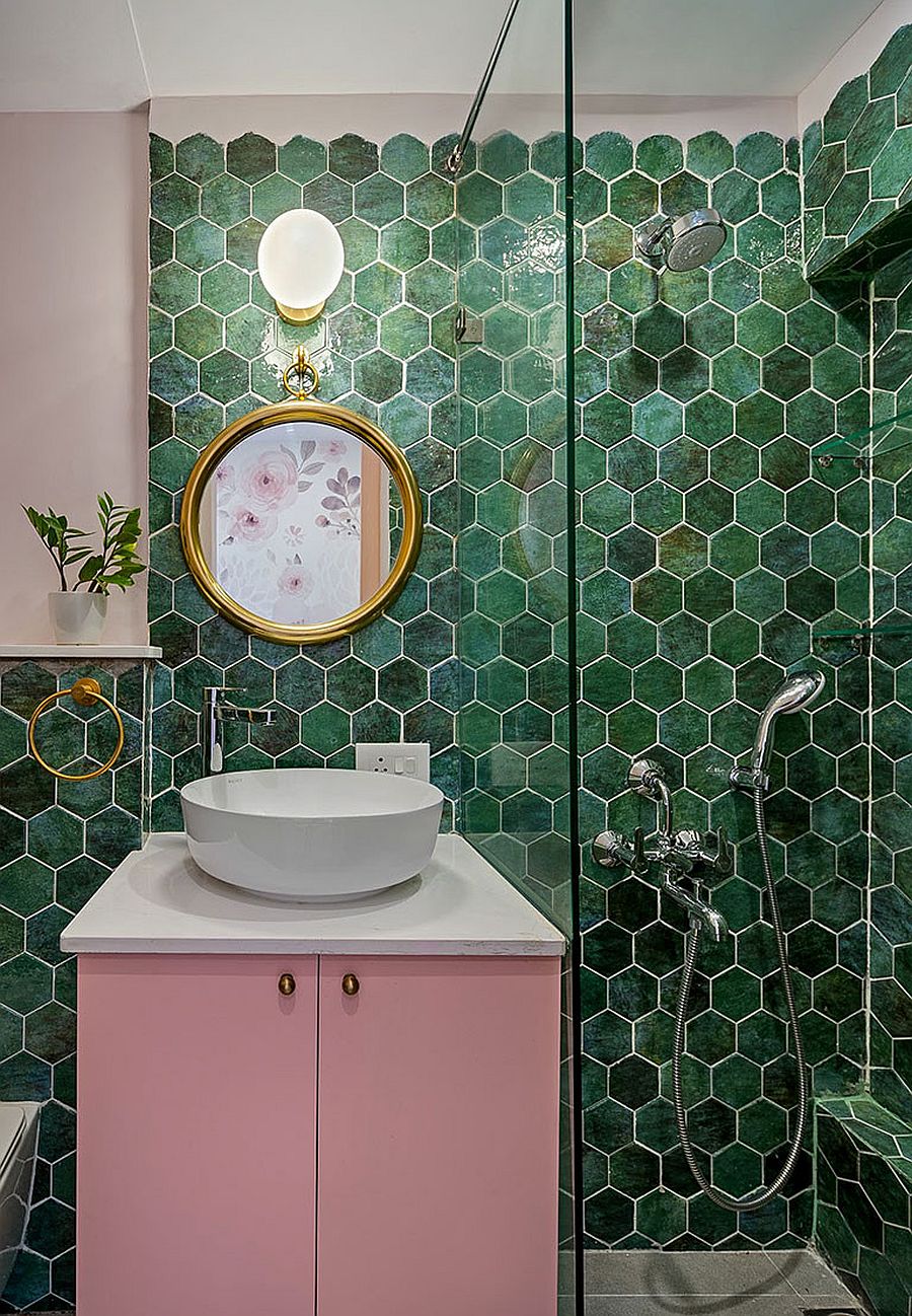 Contemporary bathroom with hexagonal wall tiles in different shades of green and a smashing pink vanity