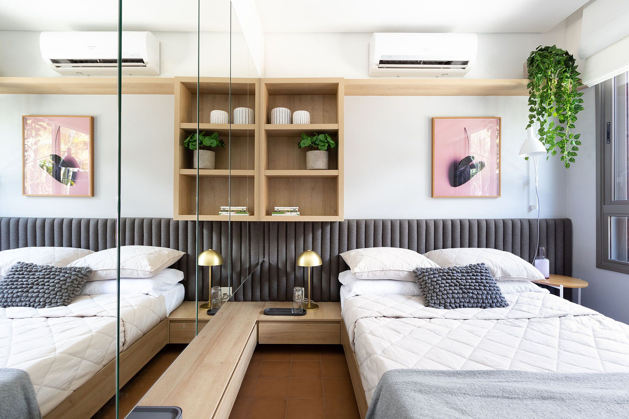 Custom gray tufted headboard for the bedroom with twin beds in neutral hues