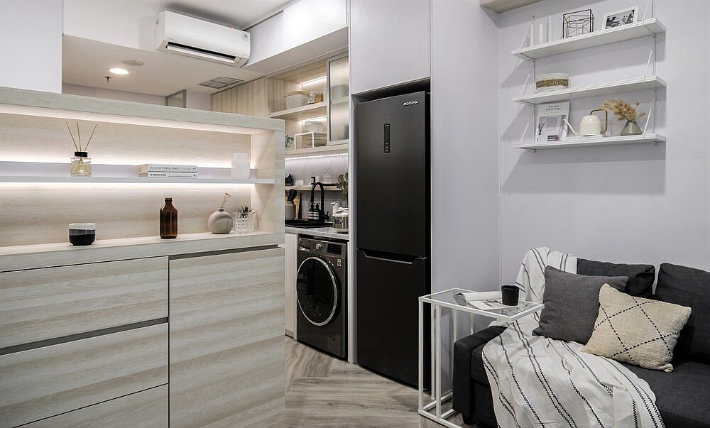 Custom niches hold the appliances inside the micro apartment