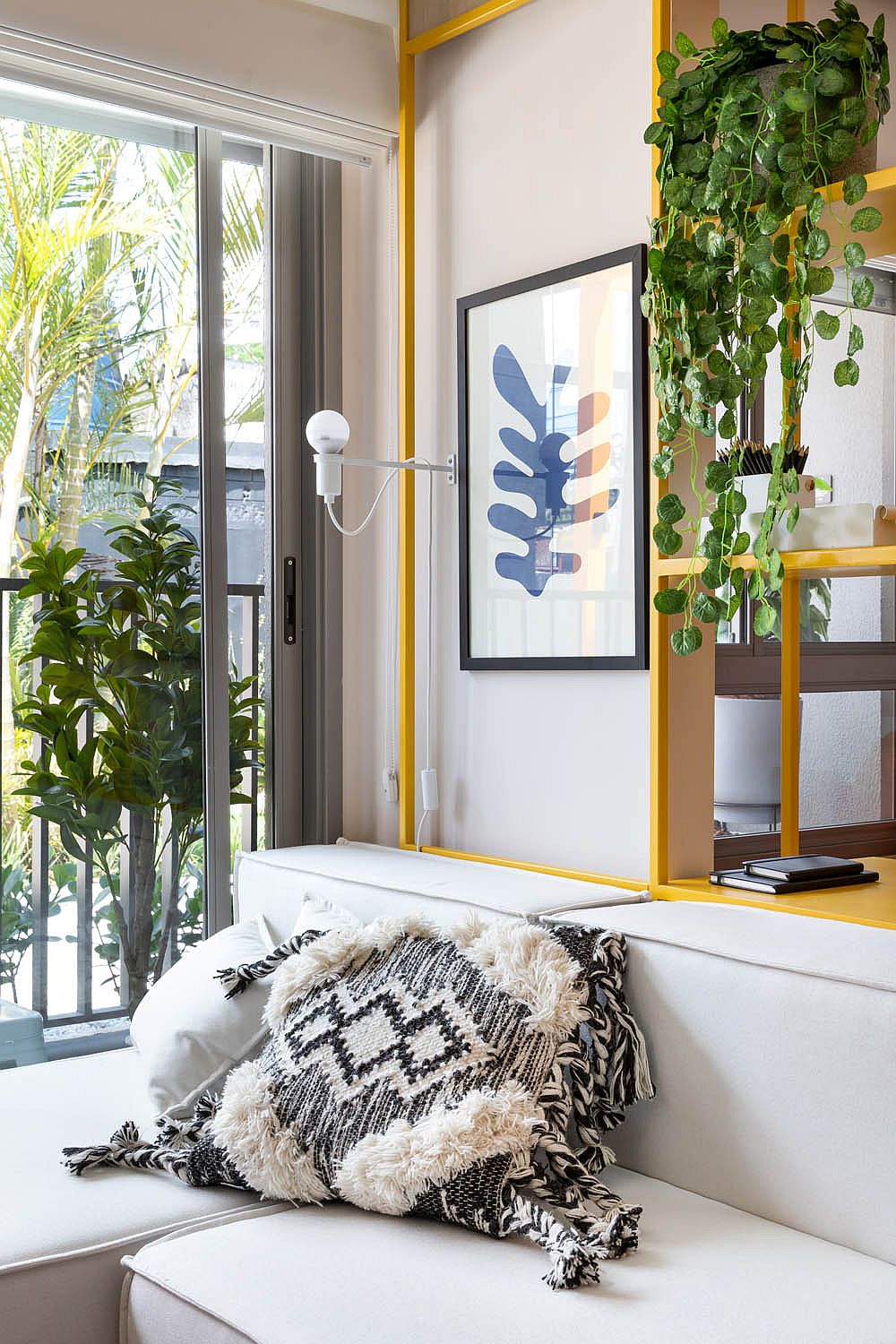 Daybed that doubles as single bed for guests inside the small apartment