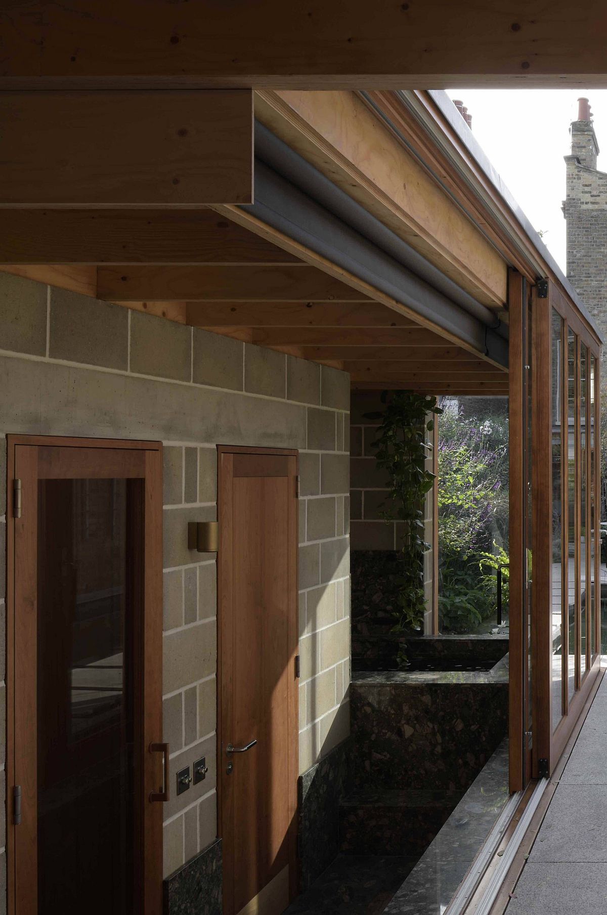 Engineered timber roof structure coupled with blockwork walls for the garden room