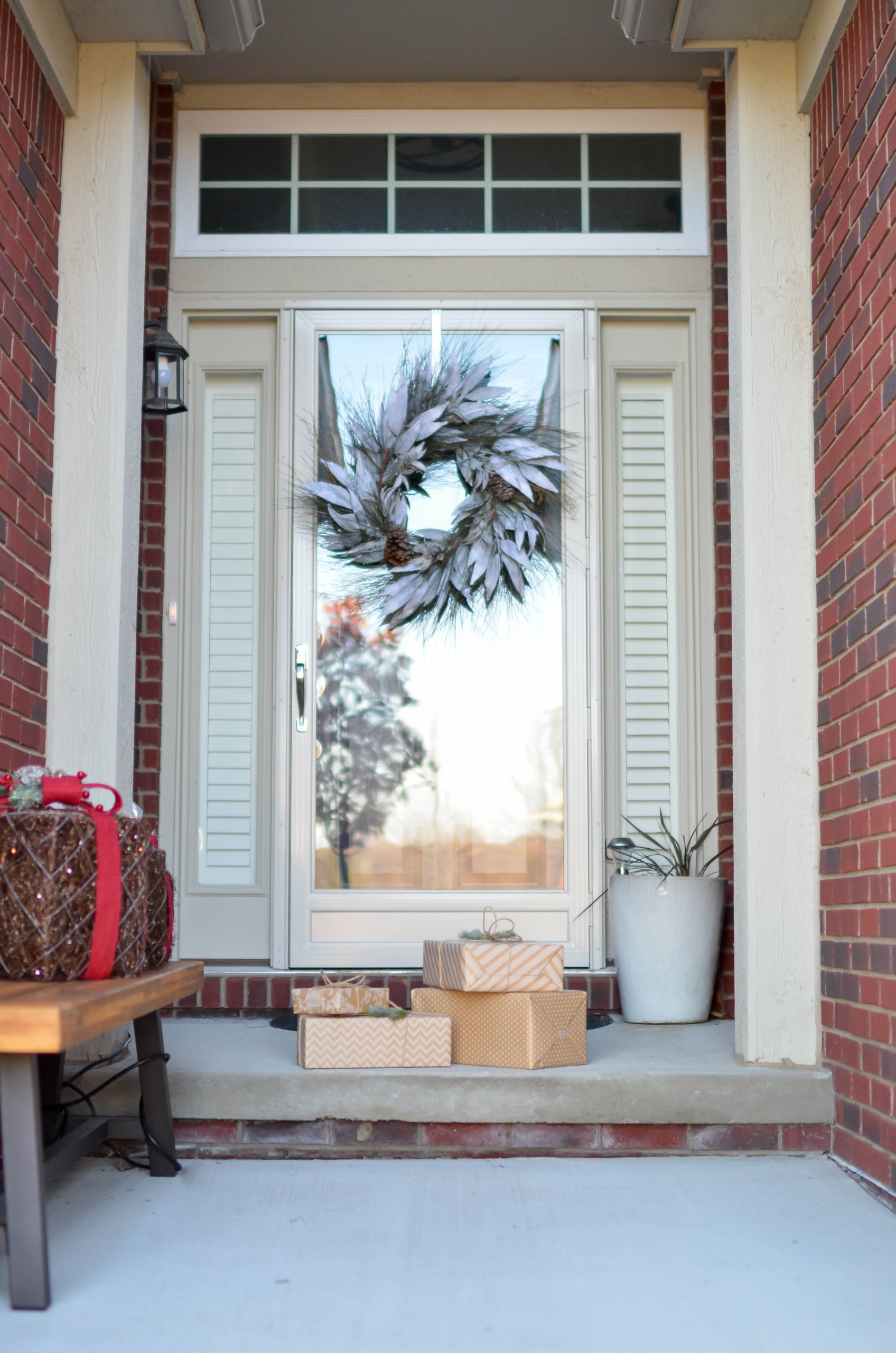 Four brown boxes in front of white glass panel door