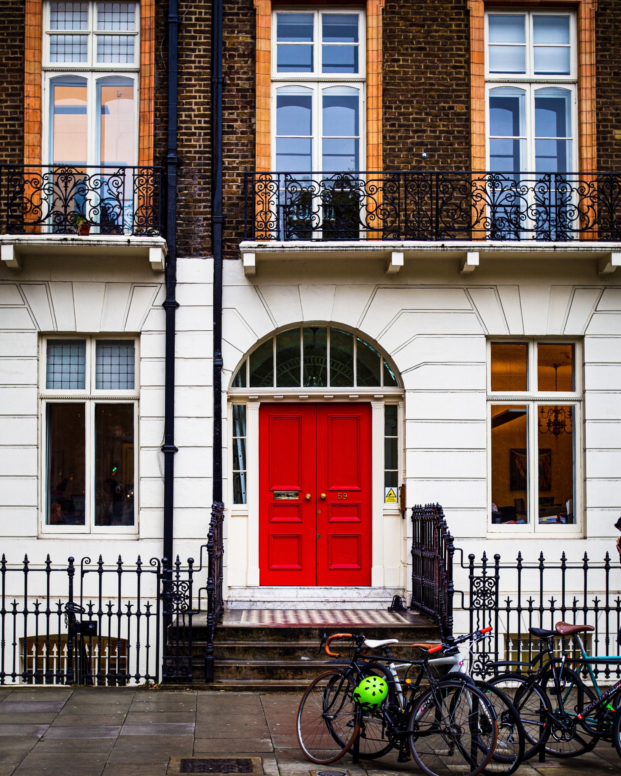 Front house with red door and bicycles