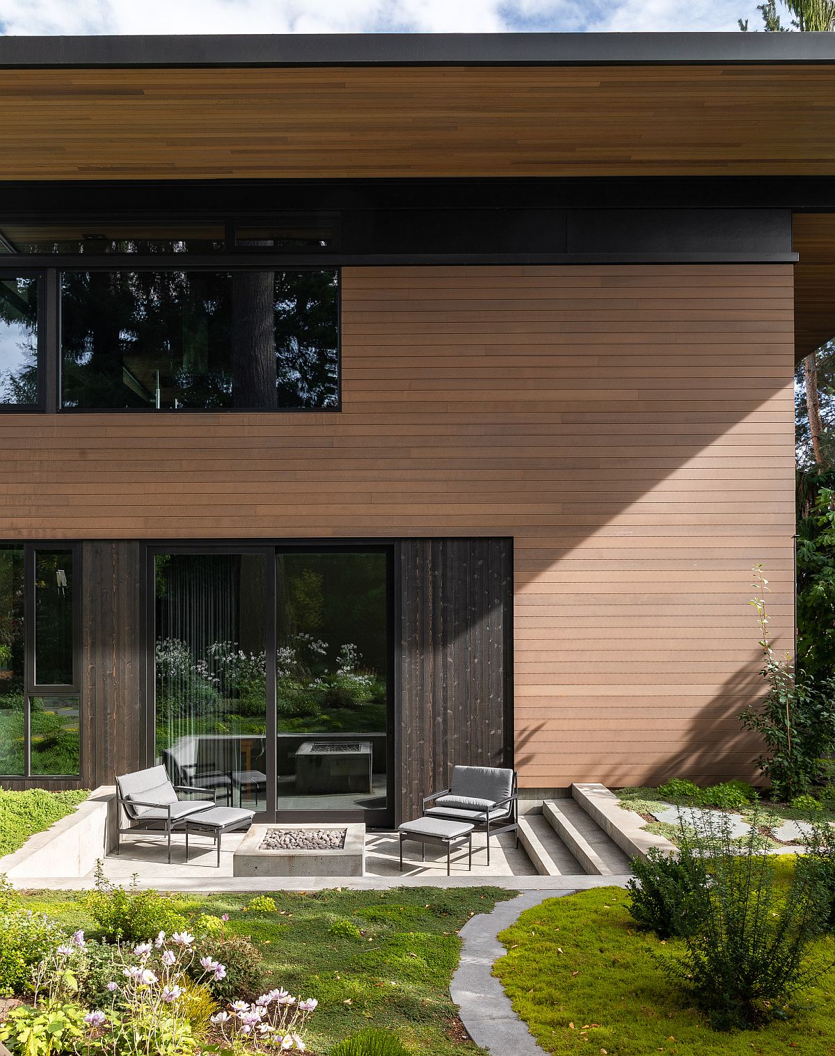 Gorgeous green landscape coupled with smart outdoor sitting area around the house