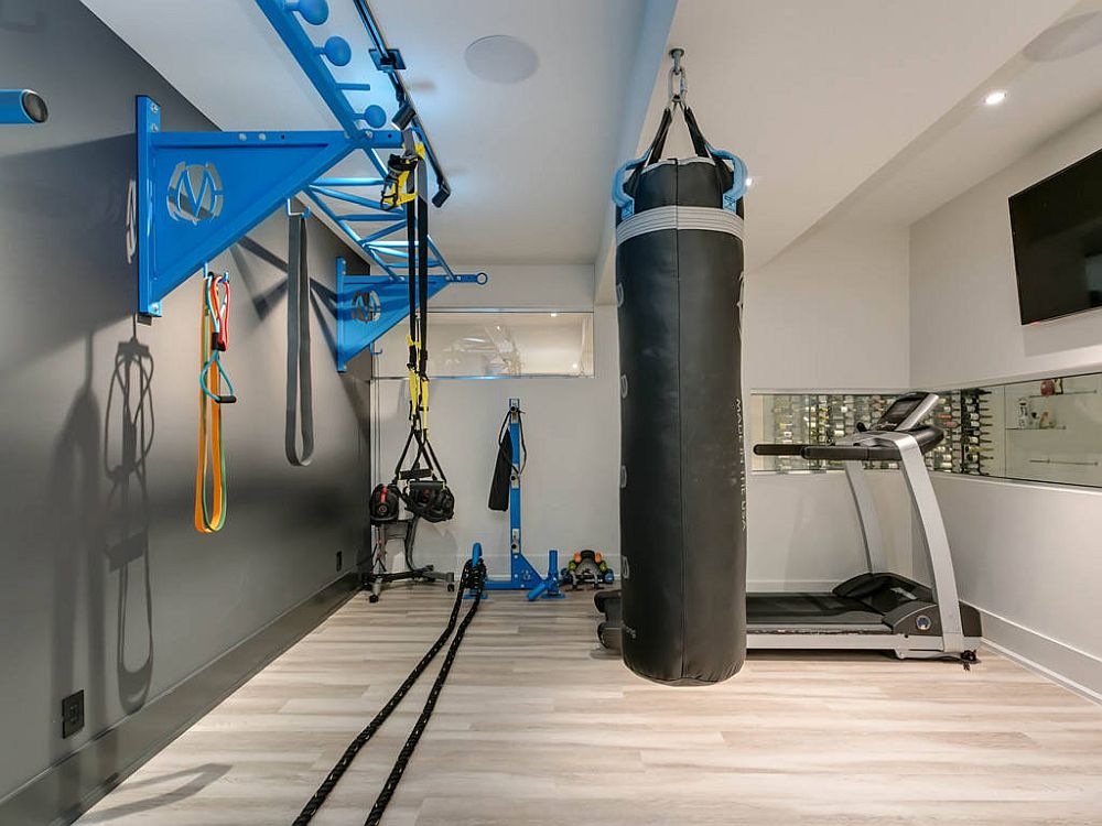 Gray accent wall for the small home gym in white