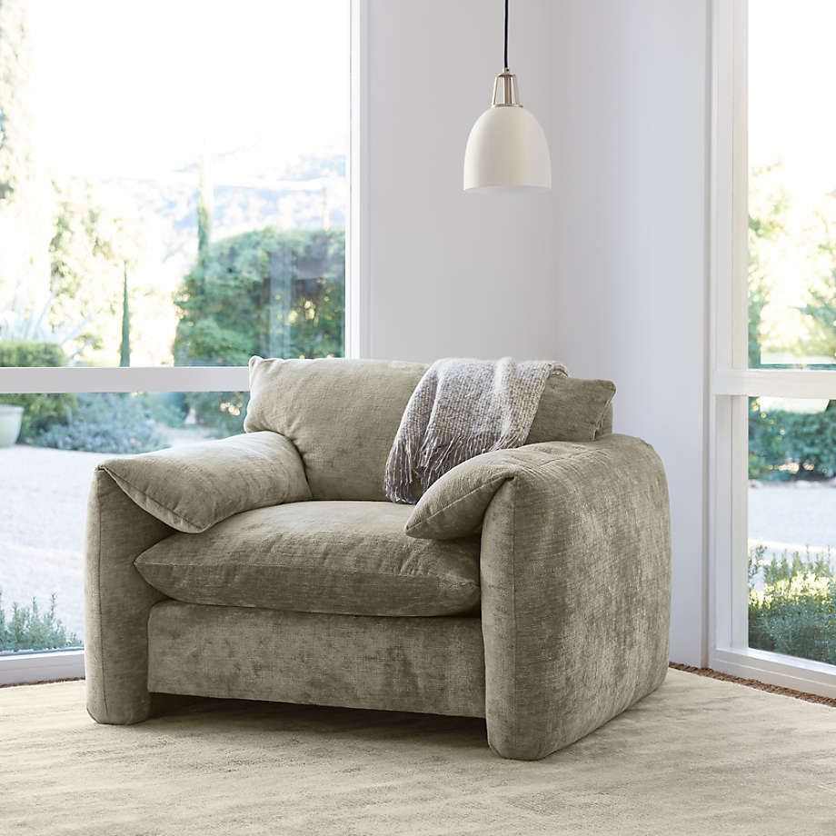 Grey oversized armchair with hanging light