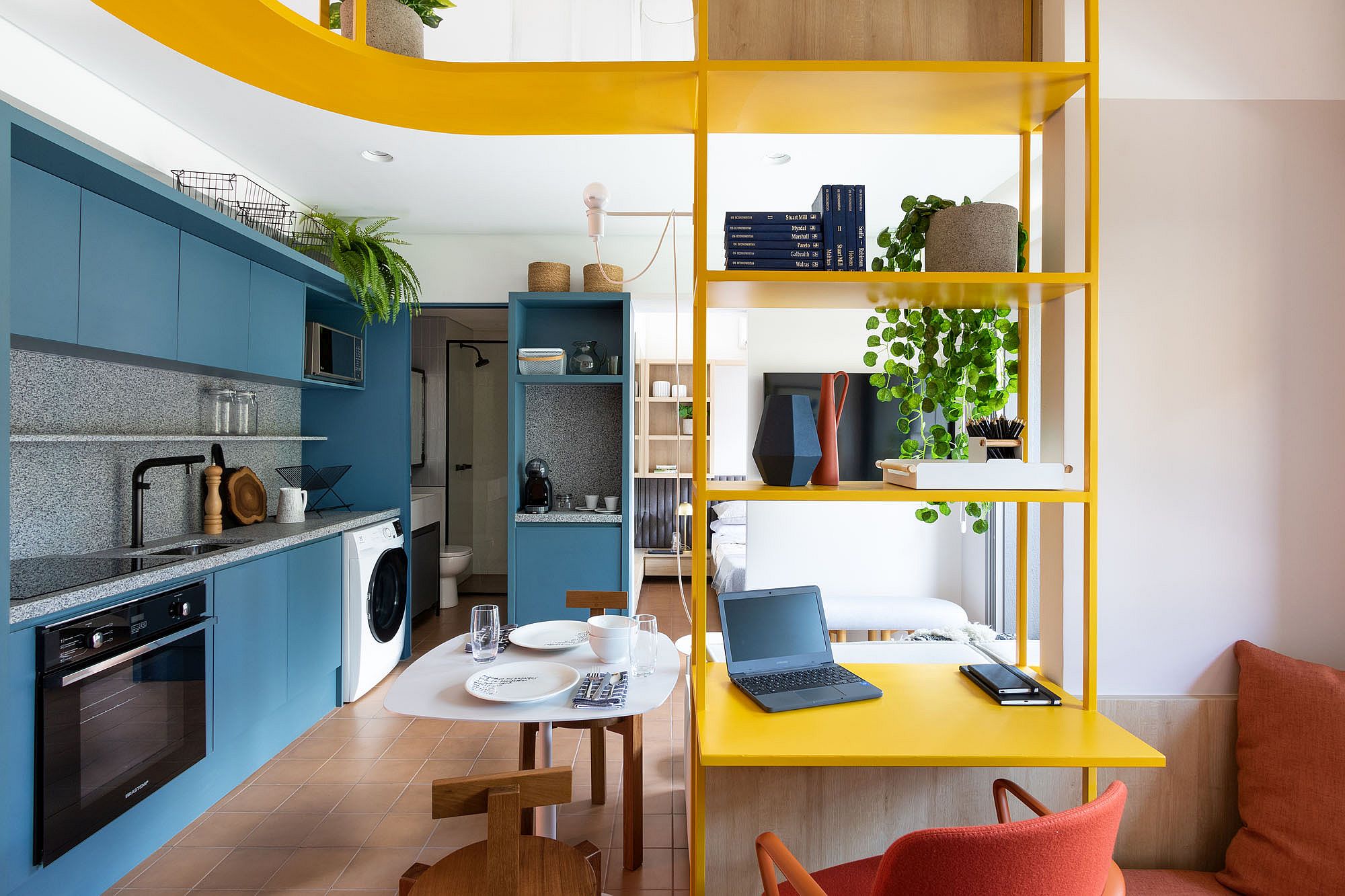 Vivid Splashes of Blue and Yellow Invigorate this Space-Savvy Brazilian Apartment