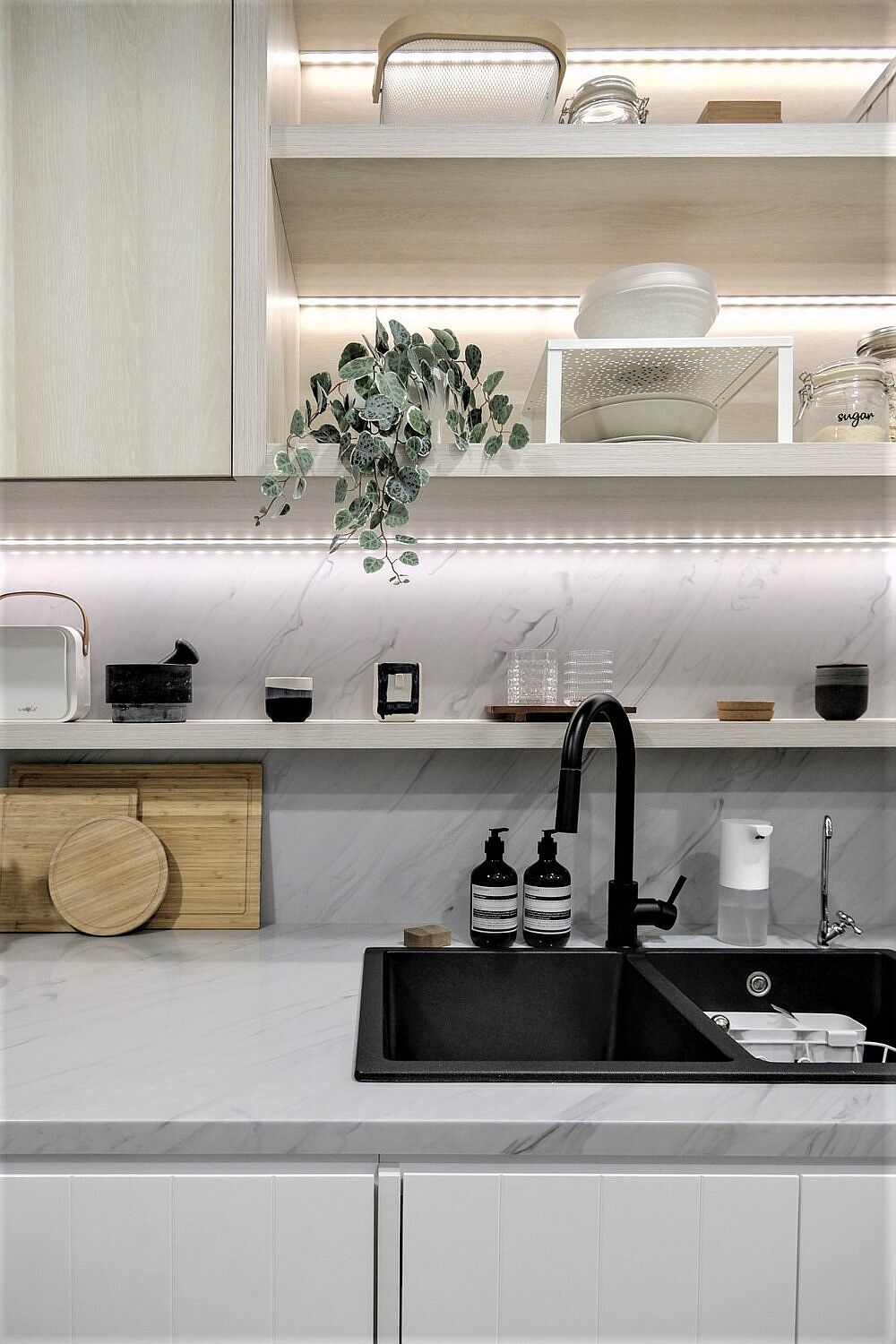 LED strip lights under the shelf adds brightness to the kitchen in neutral hues