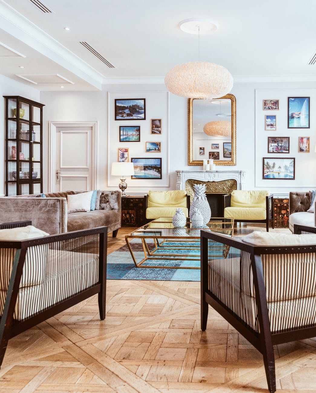 Living room interior with large chandelier and mirror