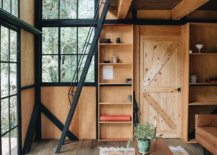 Locally-sourced-pine-wood-coupled-with-glass-and-metal-windows-inside-the-stylish-cabin-69890-217x155