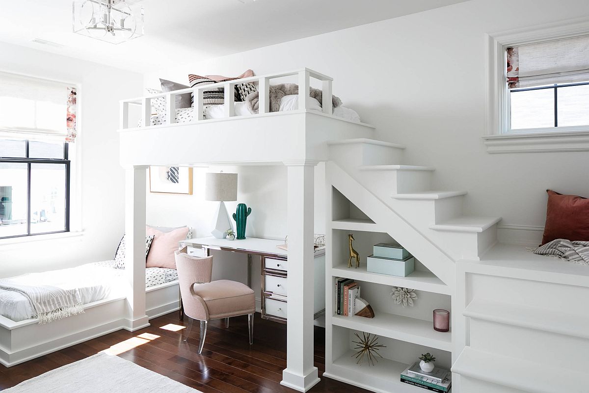 Loft bed in the shared white kids' room with ample storage and study space underneath